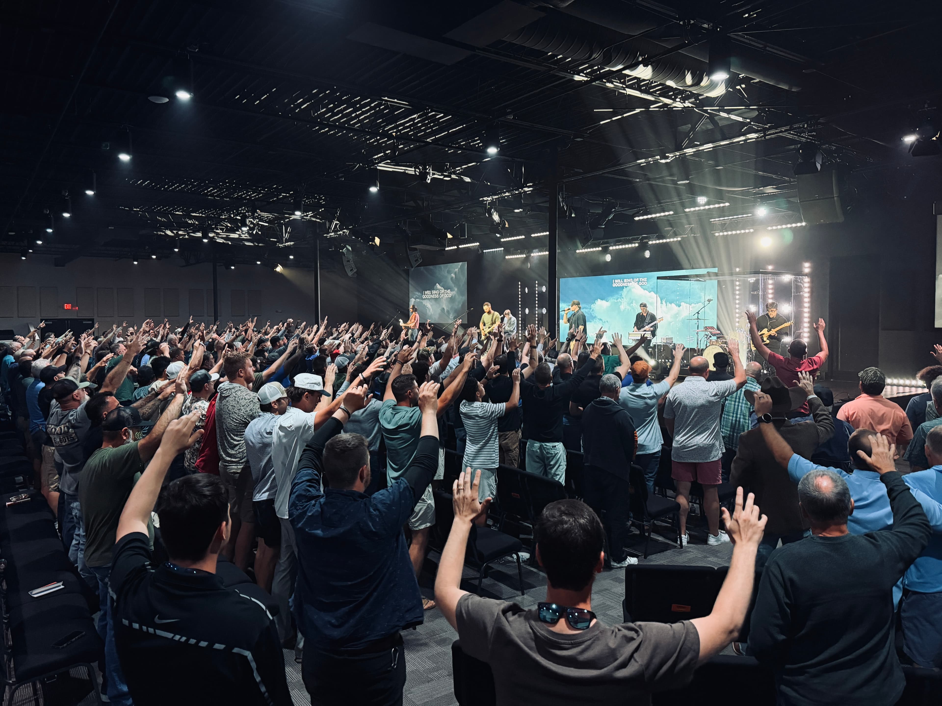 Men's room raising hands worshiping